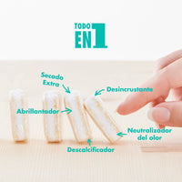 Pastillas concetradas de lavavajillas formando una fila donde se puede leer los beneficios del producto: desincrustante, secado extra, abrillantador, descalcificador, neutralizador del olor.